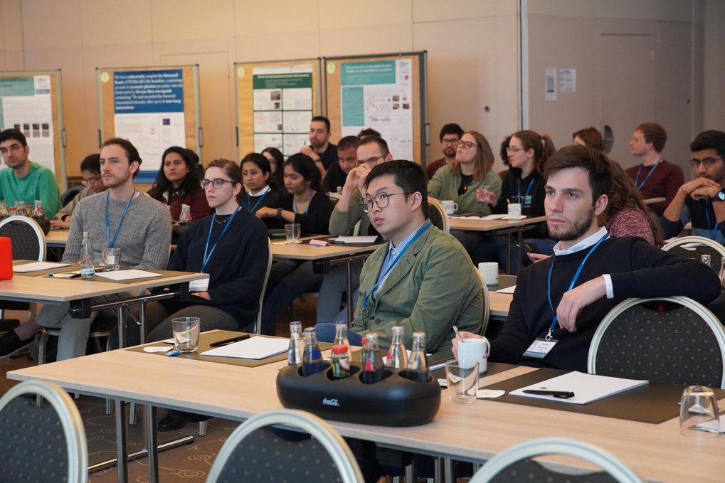 People sitting at tables in a classroom 