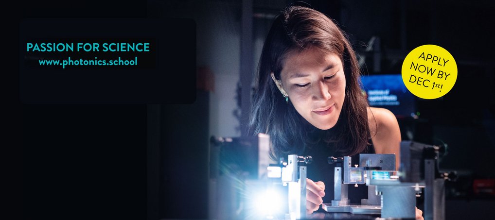 Woman working in a lab with a lens
